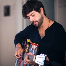 Lee Perreira playing guitar 