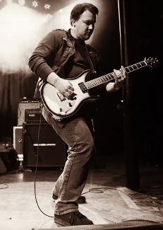 David Heida plays guitar